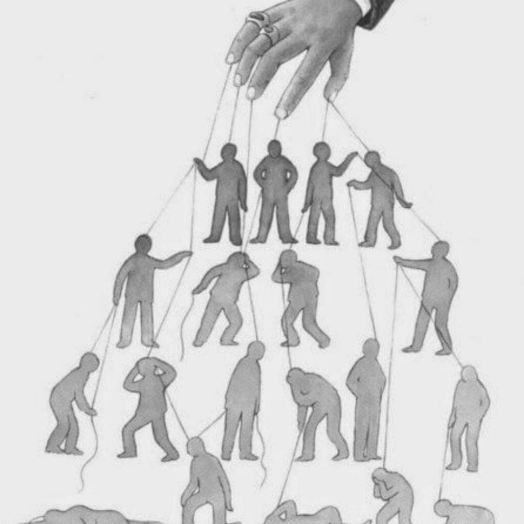 Uma mão manipulando pessoas como se fossem marionetes, o que pode ocorrer com as leis ambientais.